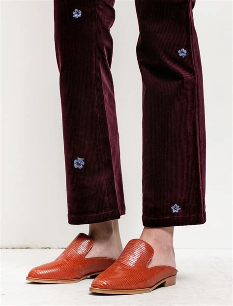 Embroidered wool pant in burgundy .